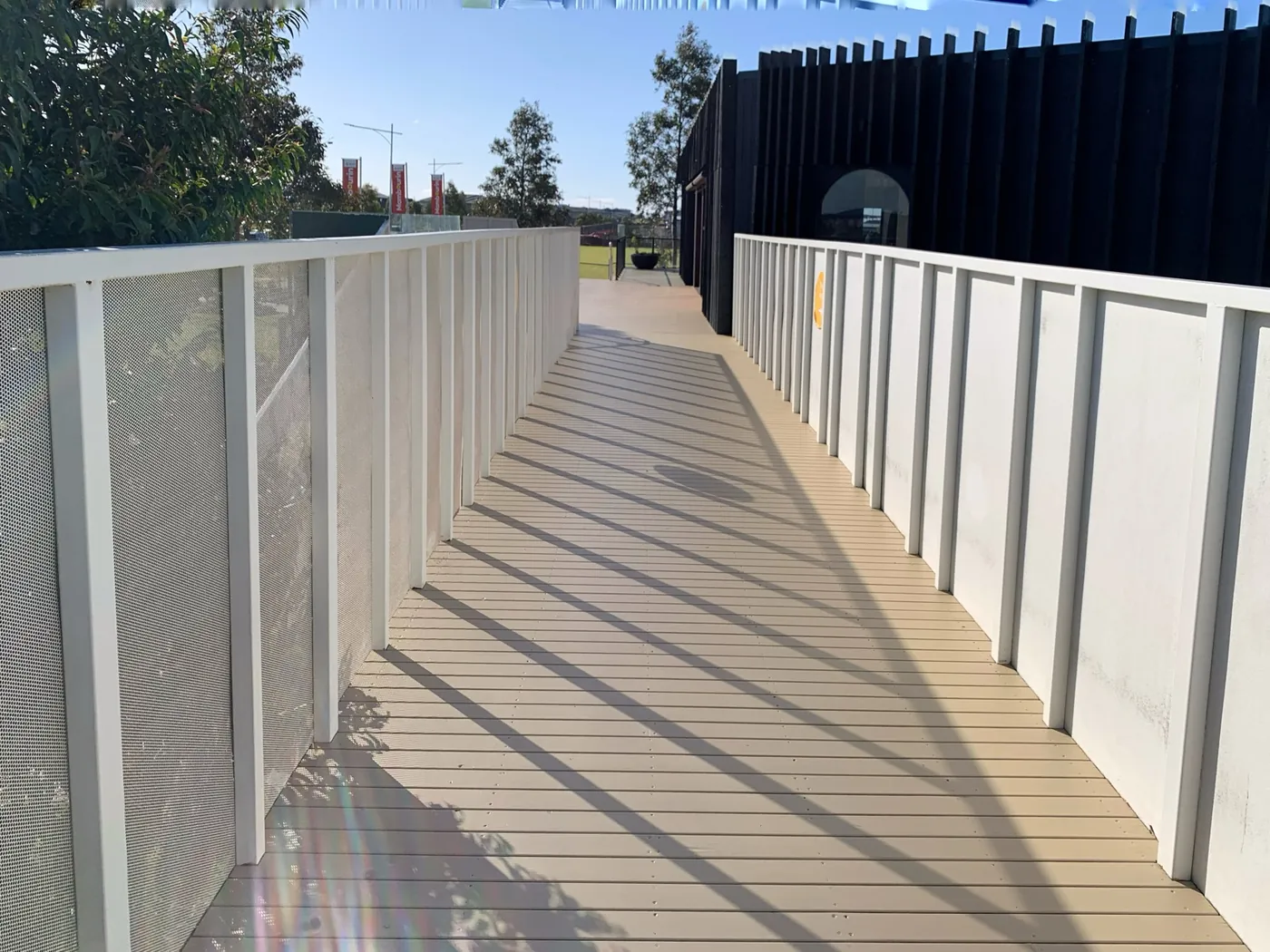 Same access ramp after, recoated in a warm sand tone, Point Cook