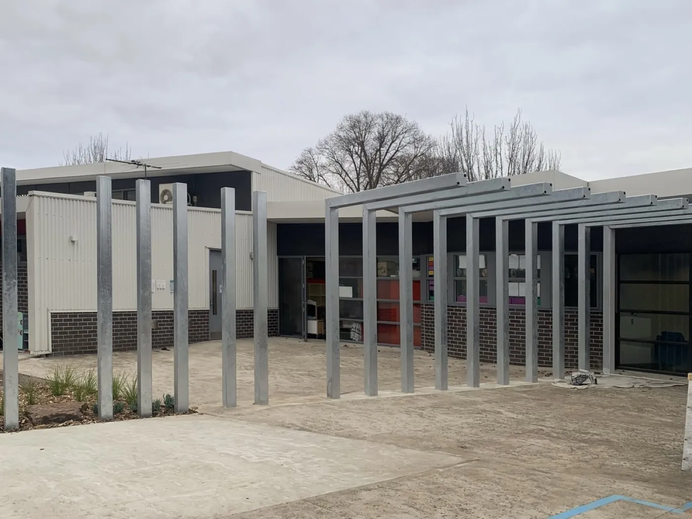 Bare galvanised steel school colonnade before, Essendon