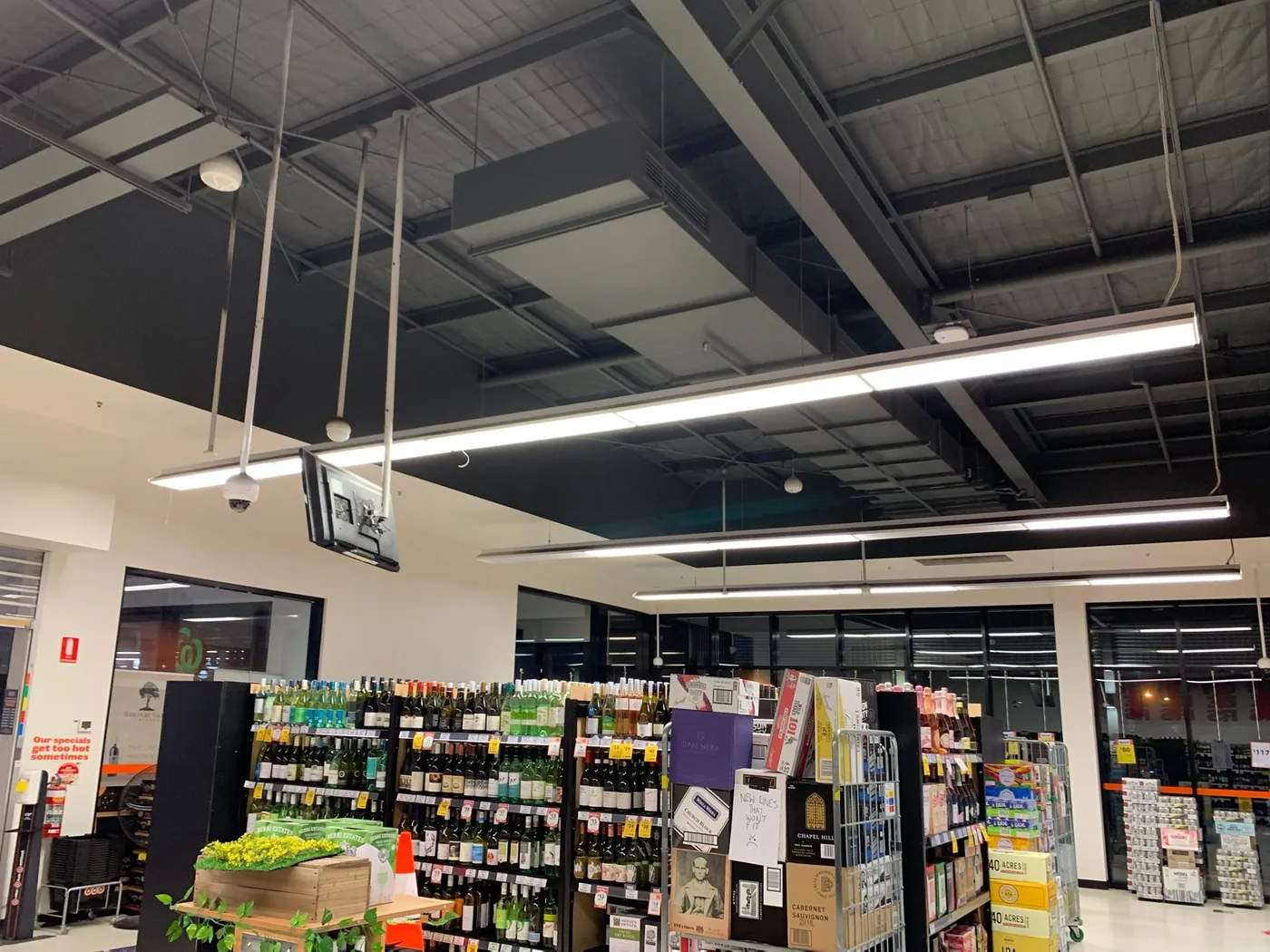 Finished black ceiling running the width of the trading floor over the wine aisles, Ballarat