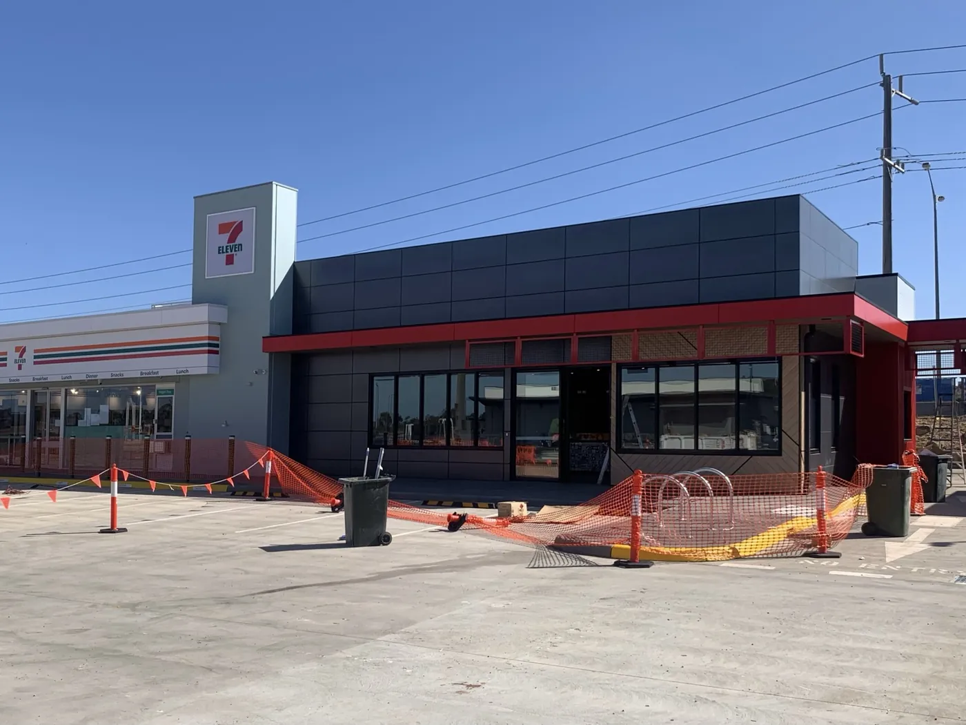 7-Eleven store front with signage tower and charcoal panels, Sunbury