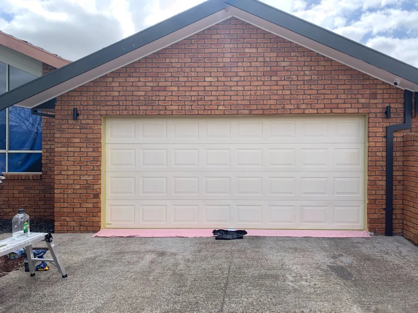 Cream panelled garage door in Greendale before