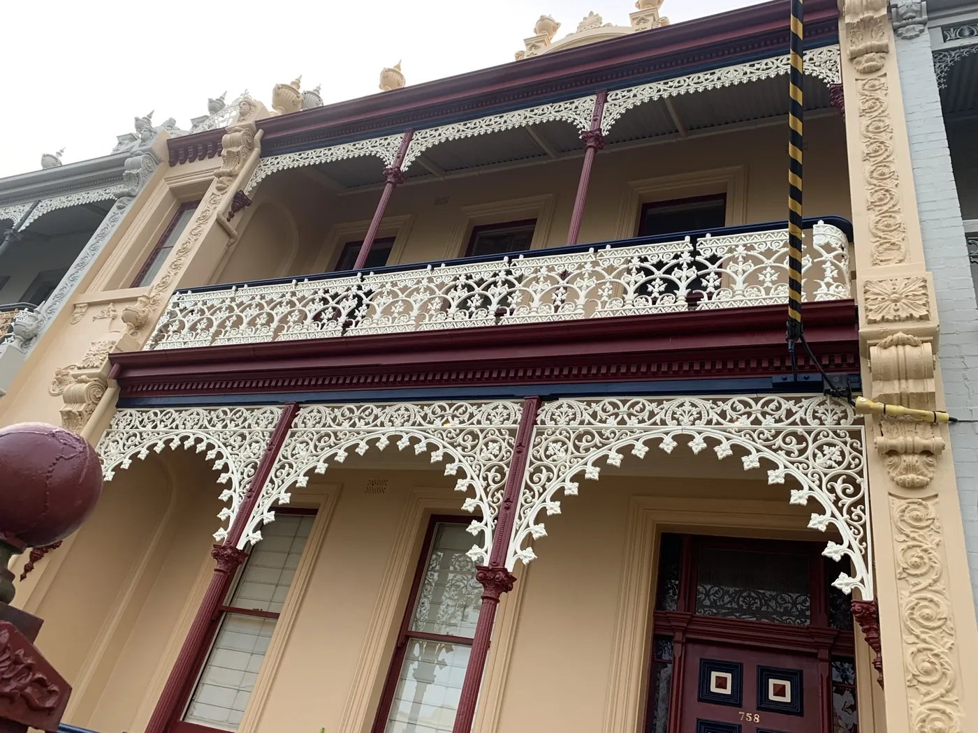 Cast iron lacework on a Victorian terrace, picked out by hand
