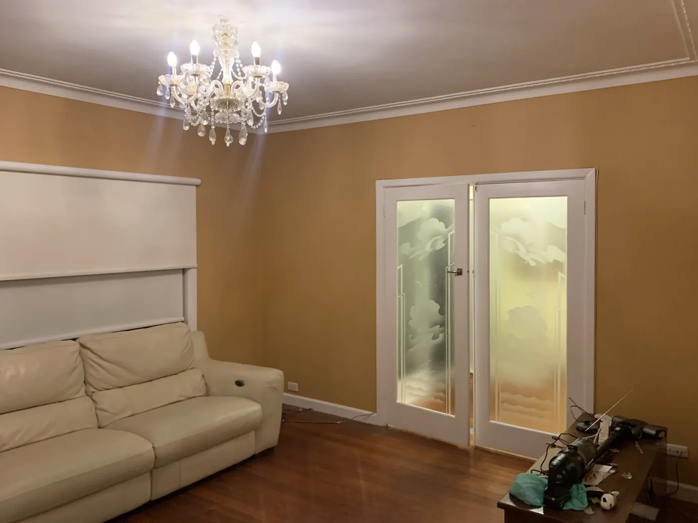 Finished lounge in warm apricot with the etched glass doors and cornice in white, Oakleigh