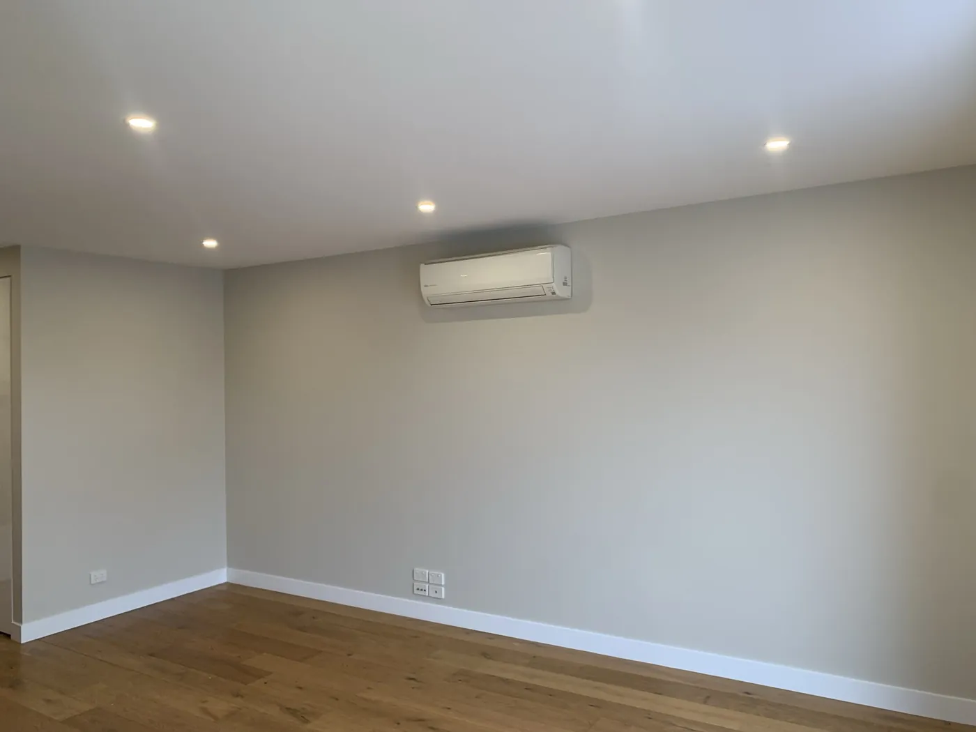 Same living room finished in warm greige with white skirtings and the oak floor uncovered, Preston