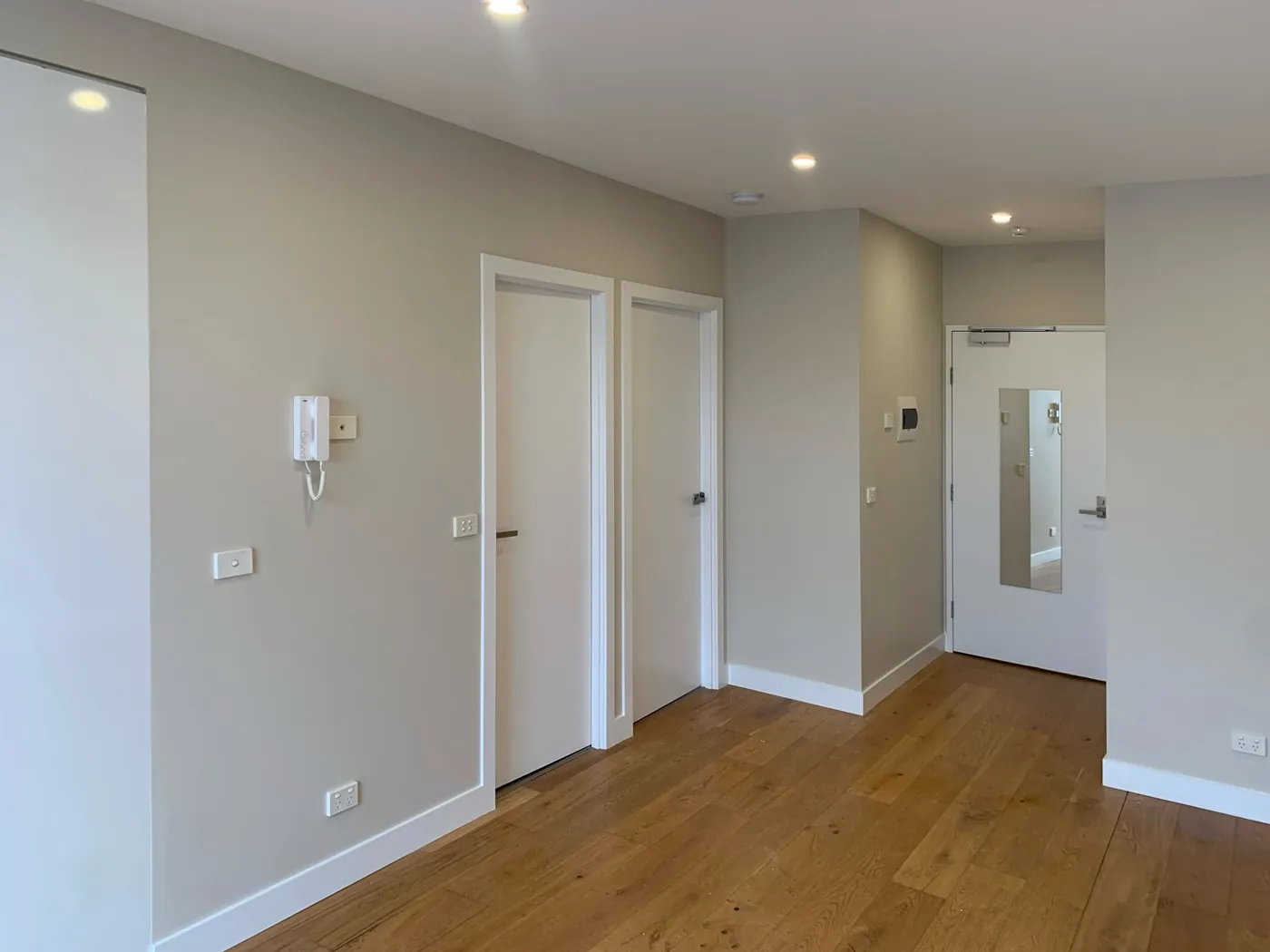 Same entry and living finished, warm greige walls with white doors and architraves, Preston