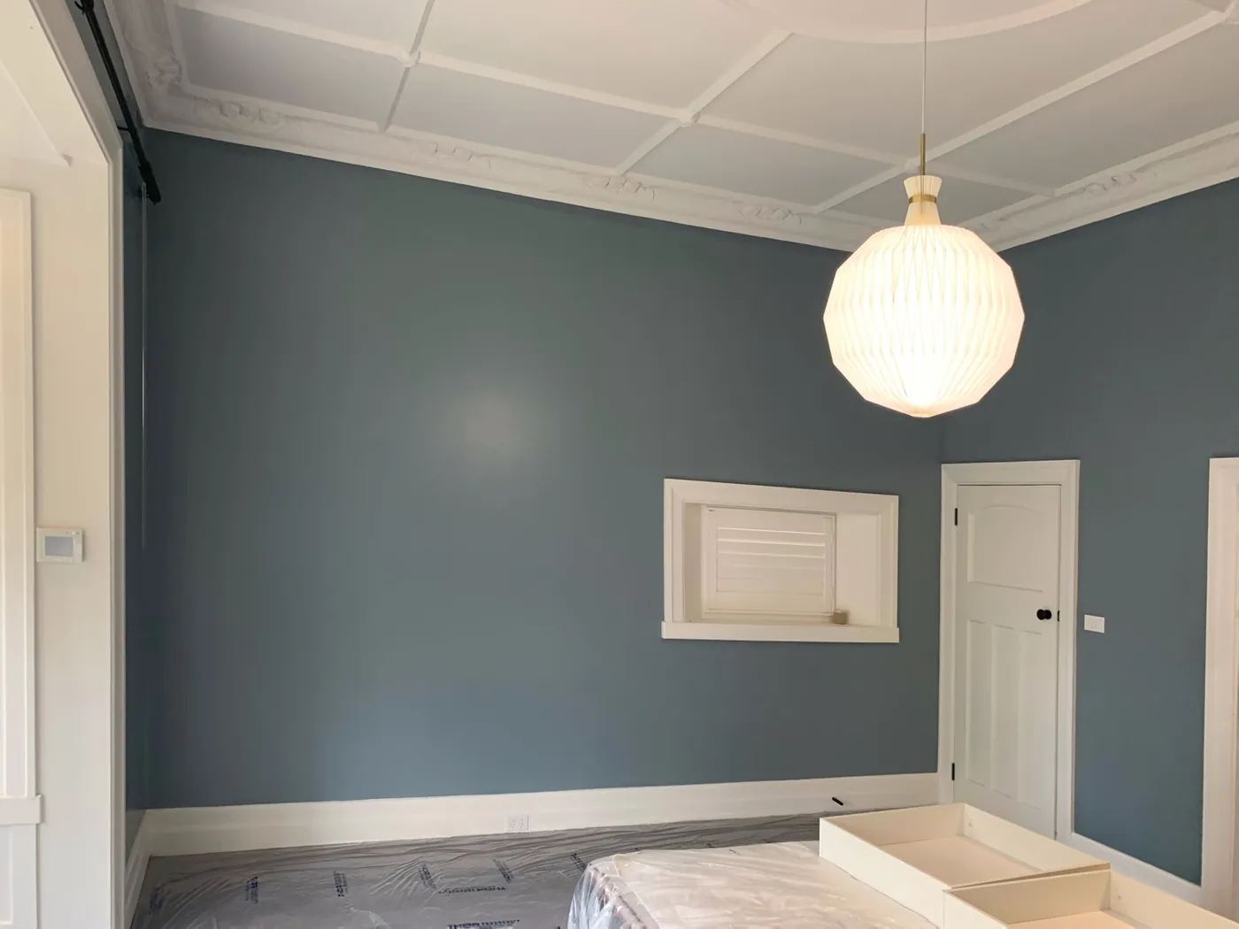 Hallway in a Brighton period home, deep blue grey walls under a white coffered ceiling