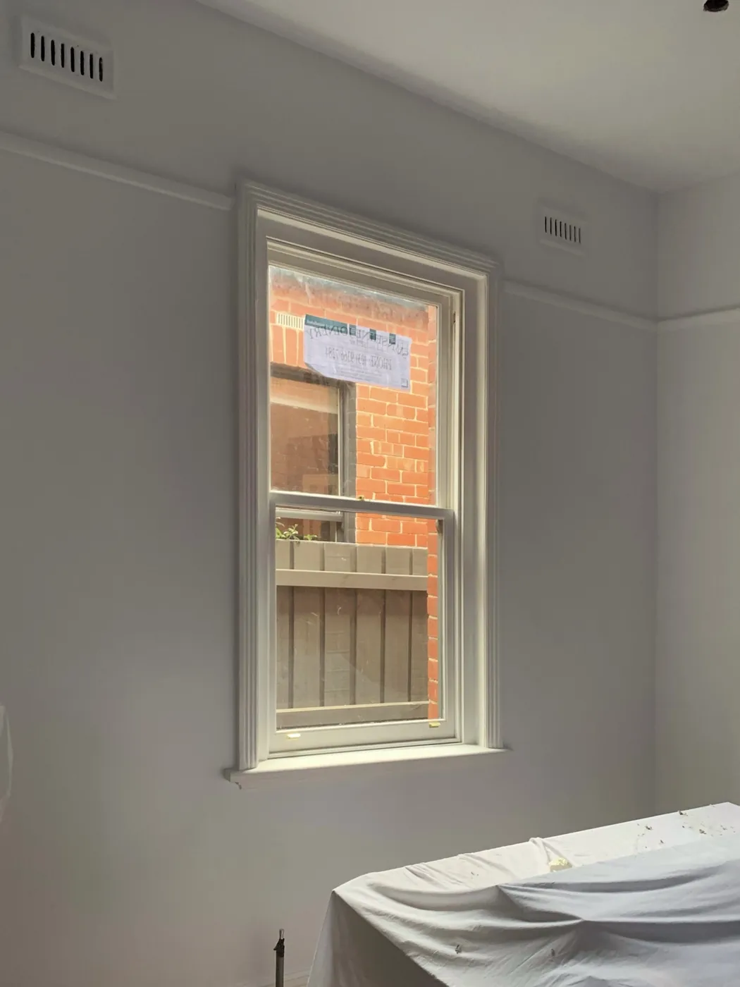 The same bedroom finished in off white with the sash window and picture rail cut in clean, Armadale