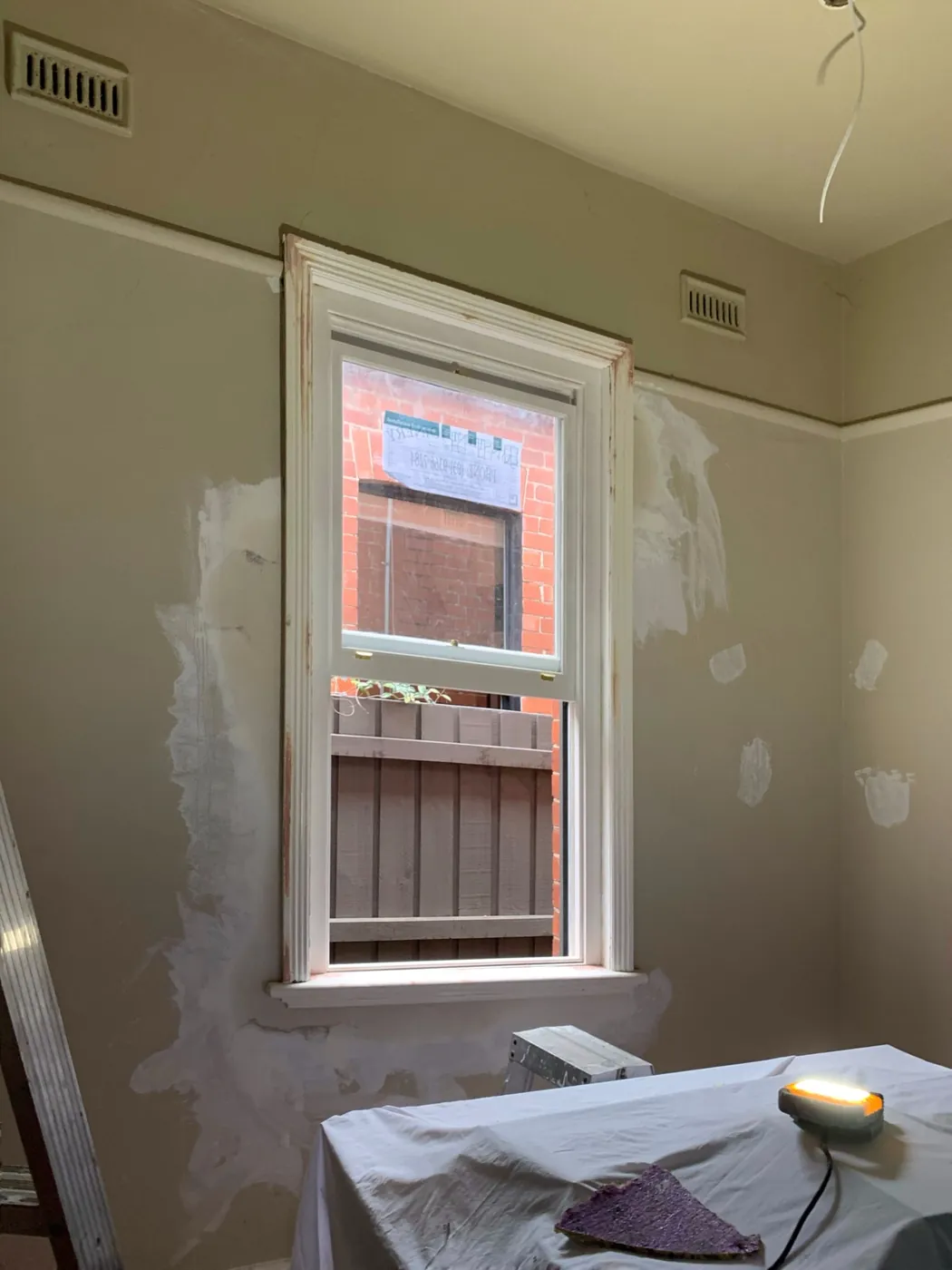 Bedroom before, filler patches around the sash window and along the picture rail, Armadale