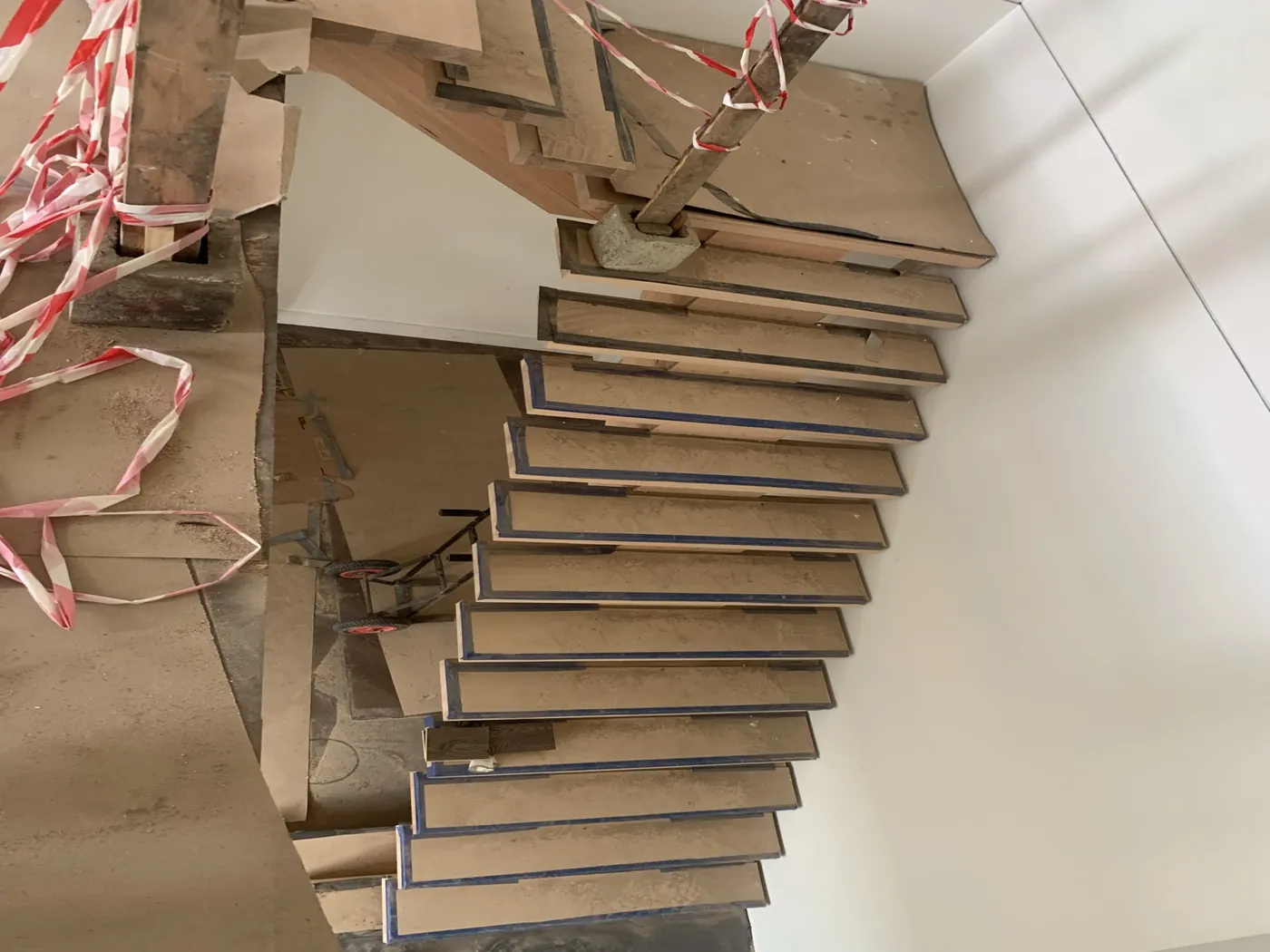 Looking down the flight before, treads still protected and taped during construction, Doncaster