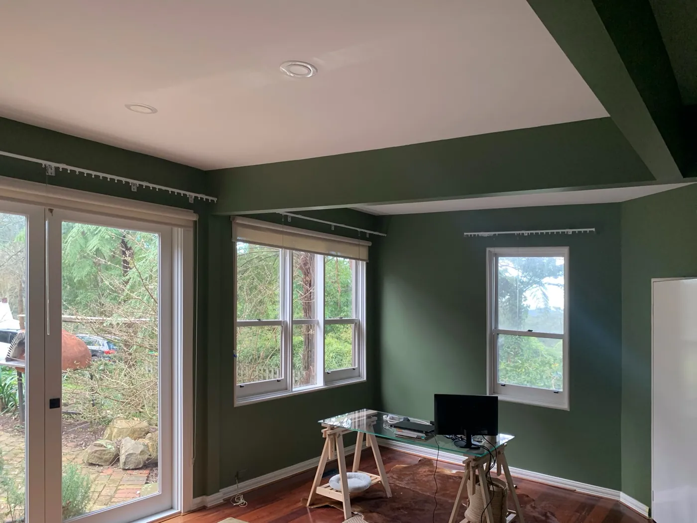 Same study in deep olive with the ceiling beam and window frames kept white, Ferntree Gully