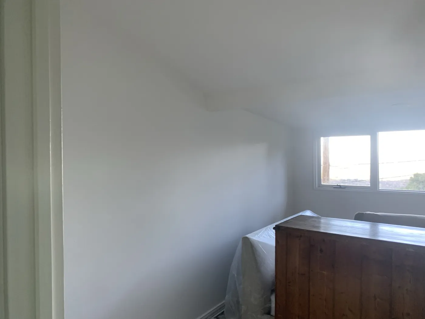 Second bedroom before, white walls with the timber chest of drawers covered up, Ferntree Gully